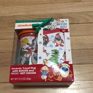 Travel mug with socks and hot coco